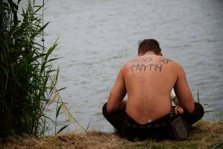 Re-enactor with the rune tattoo ‘warrior of truth’ at the Slavic and Viking Festival in Wolin 2017. Photo: Jakub T. Jankiewicz, © Wikimedia Commons